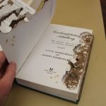Book showing extensive silverfish damage